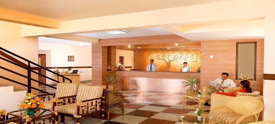 The welcoming lobby at Mysore Mayflower Hotel
